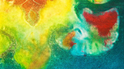 Abstract watercolor painting with butterfly-like red, orange, and turquoise forms floating amid vivid yellow, green, and blue washes; dreamlike tone.